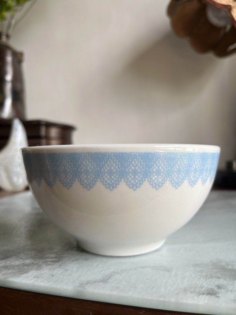 Ceramic Bowl with Blue Lace Design (Category: Dinnerware & Cutlery) located in Taguig. Submitted by minmin_parker (Listing ID 1436767810, Image 2). Description: - Ceramic bowl with a delicate blue lace rim. - Features the word "feminine" inside. - Approximately 5 inches in diameter. - Stands 2.5 inches tall. - Ideal for serving small portions or as a decorative accent..
