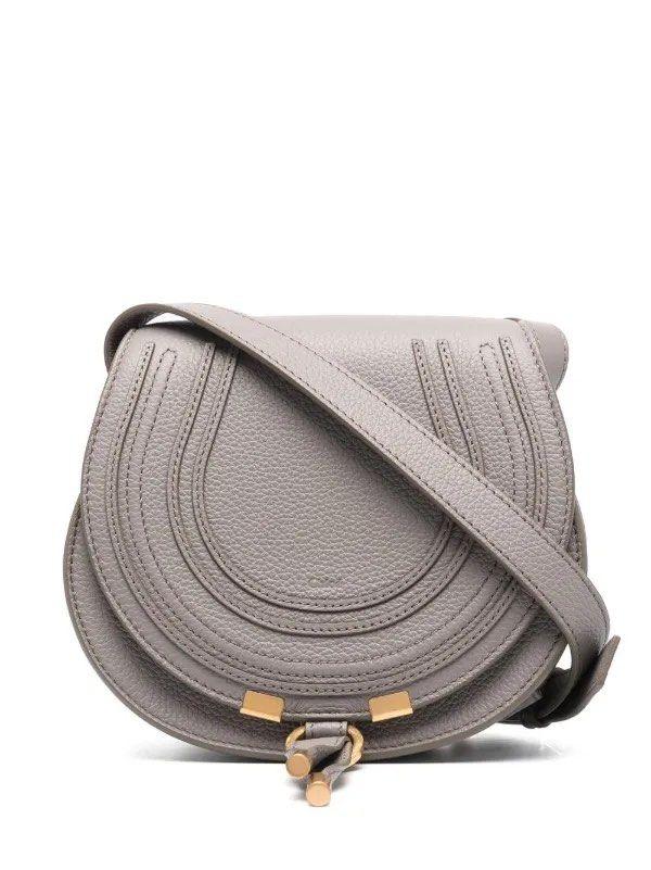 Chloe Marcie MINI Crossbody Bag (Category: Luxury Bags & Wallets) located in Manila. Submitted by decluterthings888 (Listing ID 1436813404, Image 1). Description: - Chloe Marcie crossbody bag - Grey color - Saddle silhouette - Flap closure with gold-tone metal detail - Adjustable long strap - Spacious interior - Includes a slip pocket - Perfect for everyday use.
