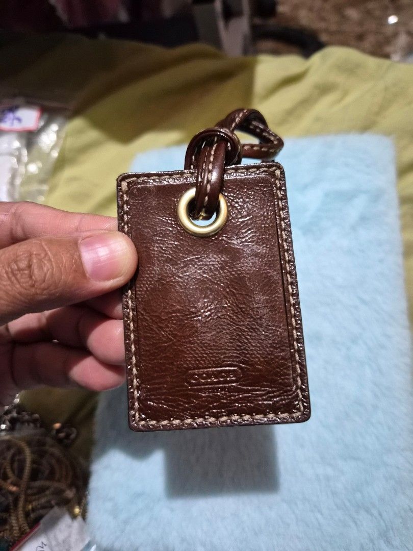 Coach Leather Luggage Tagp (Category: Other Audio Equipment) located in Mandaue City. Submitted by chuchi152615 (Listing ID 1436693956, Image 2). Description: - Genuine Coach luggage tag - Brown leather exterior - Stitched border - Gold-toned metal eyelet - Leather loop for attachment - Embossed Coach logo - Classic luggage accessory.