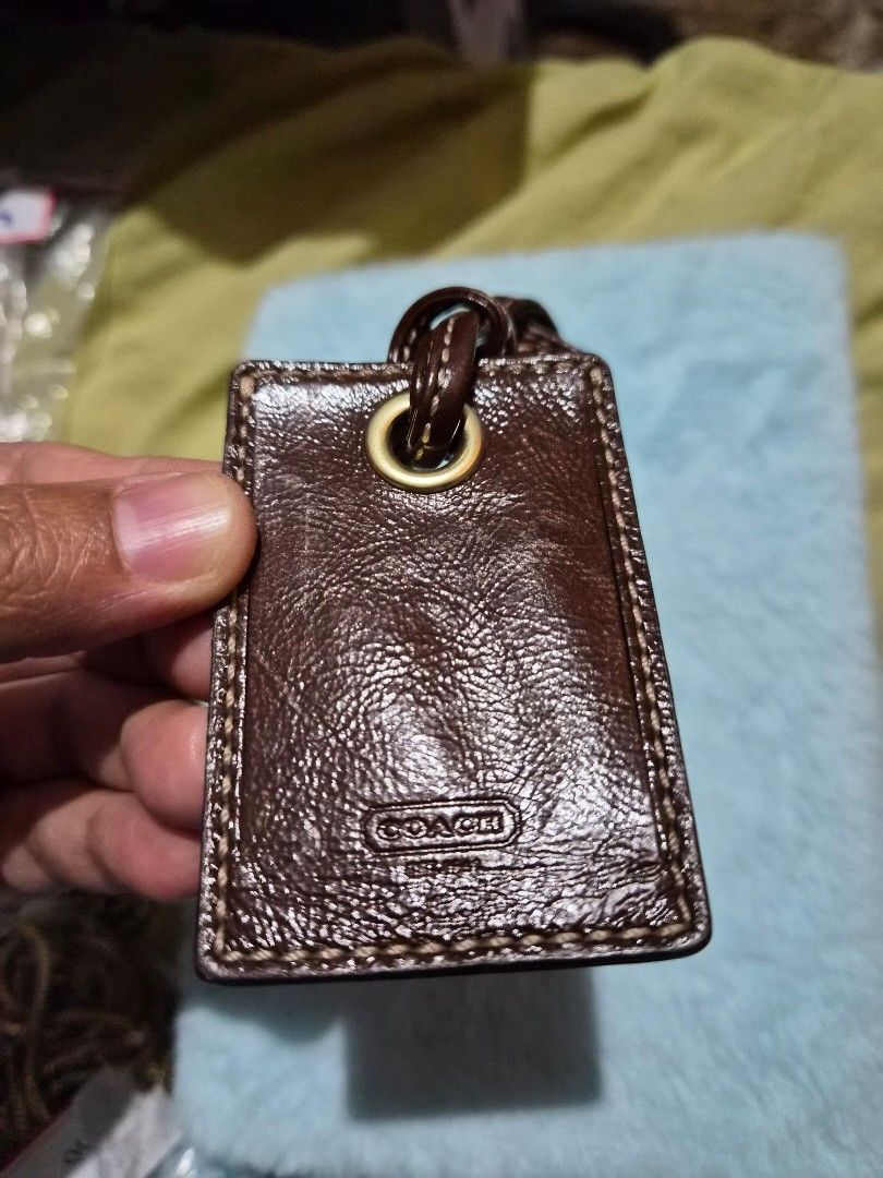 Coach Leather Luggage Tagp (Category: Other Audio Equipment) located in Mandaue City. Submitted by chuchi152615 (Listing ID 1436693956, Image 1). Description: - Genuine Coach luggage tag - Brown leather exterior - Stitched border - Gold-toned metal eyelet - Leather loop for attachment - Embossed Coach logo - Classic luggage accessory.