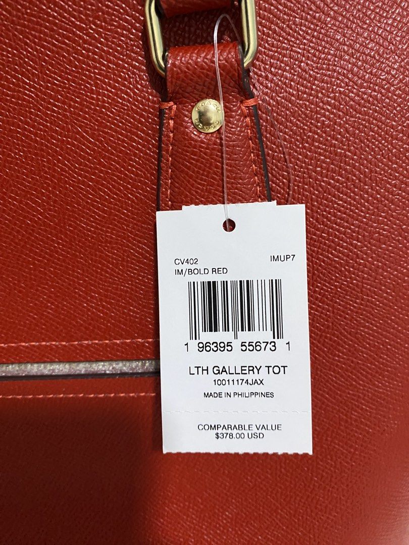 COACH Red Saffiano Carryall Bag (Category: Luxury Bags & Wallets) located in Quezon City. Submitted by wearhouze (Listing ID 1436657865, Image 3). Description: - Authentic Coach Gallery Tote Bag - Color: IM/Bold Red - Features: Zip closure, gold-tone hardware, Coach hangtag - Design: Double top handles, spacious interior - Condition: New with original tag - Made in the Philippines.