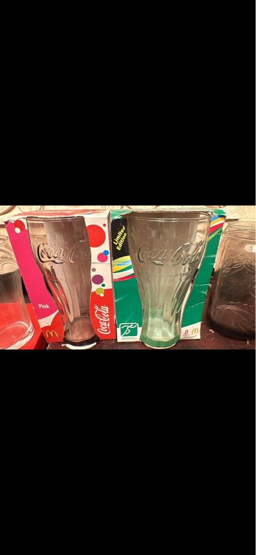 Coca-Cola Glasses Set (Category: Dinnerware & Cutlery) located in Mandaluyong City. Submitted by elainelawenko (Listing ID 1436709807, Image 3). Description: Set of Coca-Cola glasses. Includes various designs and styles, some with the classic Coca-Cola logo and others with unique shapes. Some glasses come with their original boxes. Perfect for collectors or anyone who enjoys a refreshing drink in a stylish glass..