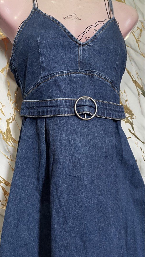 Denim Spaghetti Strap Dress with Belt (Category: Dresses) located in Zamboanga. Submitted by iqramedria (Listing ID 1436799691, Image 2). Description: Thrifted - not worn pa - Denim dress - Spaghetti straps - Fit-and-flare silhouette - Matching belt with silver-tone buckle - V-neckline - Classic denim wash - Versatile for casual or dressed-up looks.