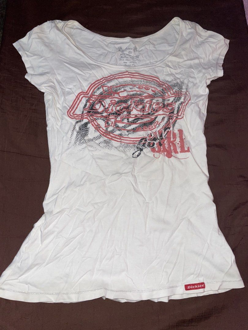 Dickies Girl White Graphic Tee (Category: Shirts) located in Quezon City. Submitted by radiusmile (Listing ID 1436796306, Image 1). Description: - White Dickies Girl t-shirt - Graphic print on front - Scoop neck - Short sleeves - Fitted silhouette - Dickies logo in red and black - Dickies tag near hem - Can fit extra small to semi-medium.