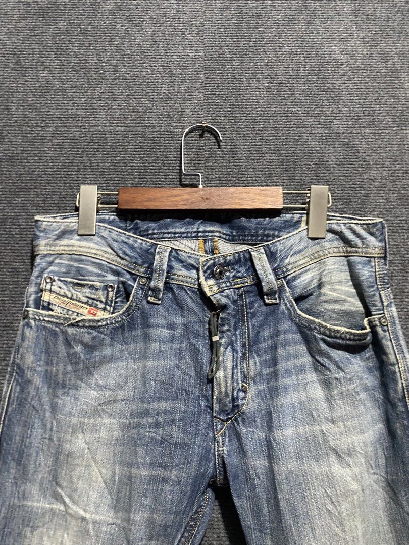 Diesel Jeans with Distressed Details (Category: Jeans) located in Bolinao. Submitted by frenced28 (Listing ID 1436787284, Image 3). Description: - Authentic Diesel jeans - Classic blue wash - Distressed detailing on front - Button fly - Small pocket with Diesel logo - Embroidered design on back pockets - Leather Diesel logo patch on back waistband.
