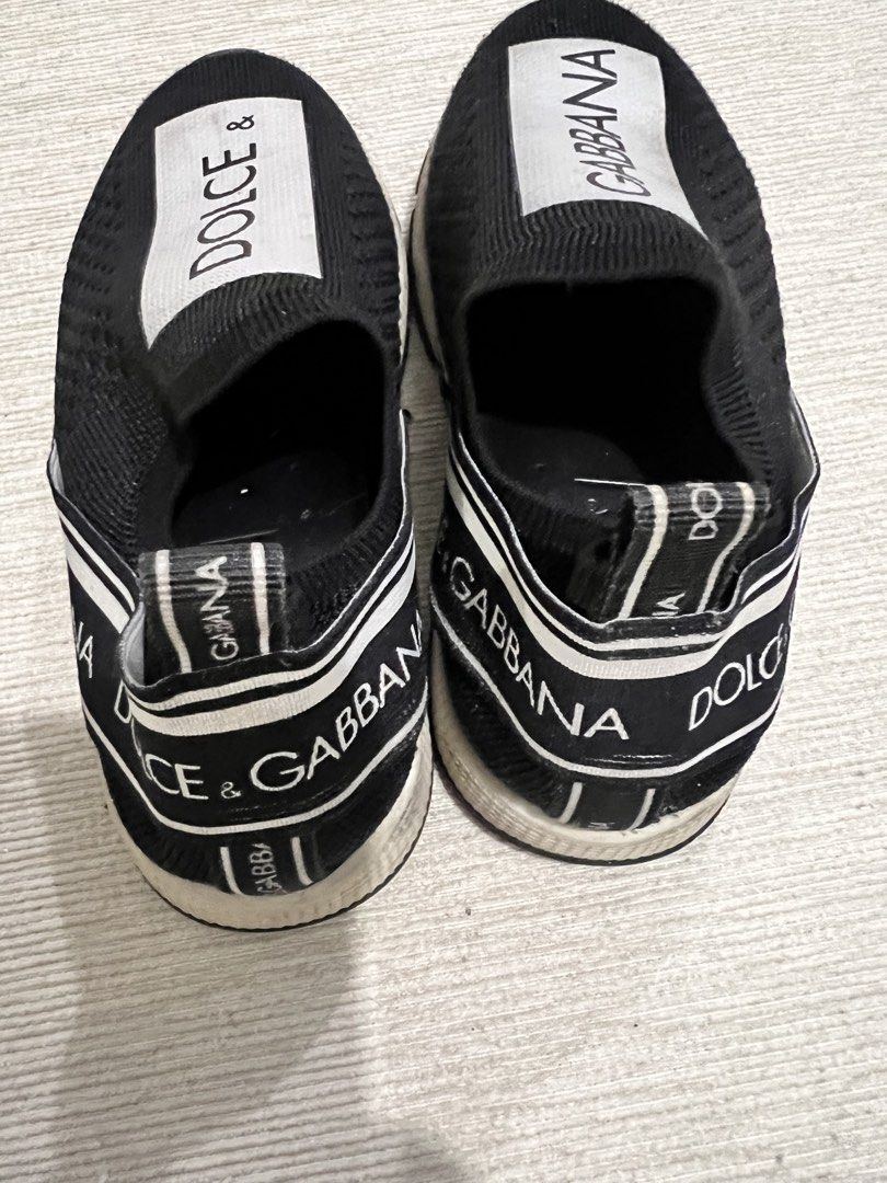 Dolce & Gabbana Slip-On Sneakers (Category: Babies & Kids Fashion) located in Bulacan. Submitted by sssss45 (Listing ID 1436753637, Image 2). Description: - Dolce & Gabbana slip-on sneakers - Black knitted upper - White sole - Dolce & Gabbana logo on front and back - Brand name on heel - Ideal for casual wear -size 26.