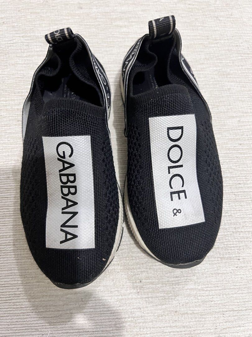 Dolce & Gabbana Slip-On Sneakers (Category: Babies & Kids Fashion) located in Bulacan. Submitted by sssss45 (Listing ID 1436753637, Image 1). Description: - Dolce & Gabbana slip-on sneakers - Black knitted upper - White sole - Dolce & Gabbana logo on front and back - Brand name on heel - Ideal for casual wear -size 26.