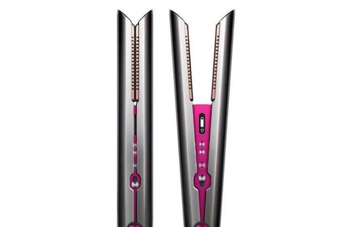 Dyson Corrale Hair Straightener (Category: Hair) located in Manila. Submitted by decluterthings888 (Listing ID 1436808982, Image 2). Description: - Dyson Corrale hair straightener - Color: Black, Silver, and Pink - Includes: Charging dock and travel pouch - Features flexing plates for enhanced styling - Multiple heat settings - Digital display - Designed to style with less heat.