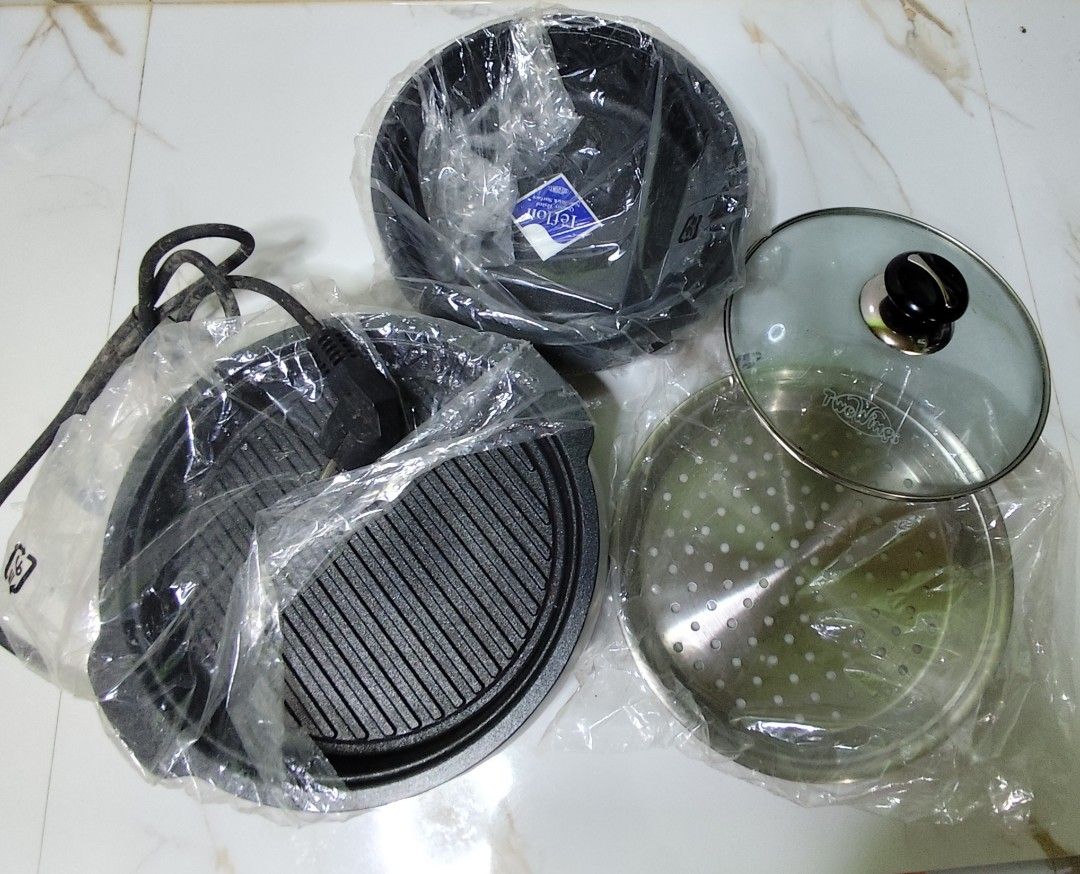 Electric Grill and Steamer Set (Category: Cookware & Accessories) located in Imus. Submitted by jmakati22717201 (Listing ID 1436657340, Image 1). Description: - Brand new electric grill and steamer set - Includes: grill plate, pot, steamer, glass lid, and power cord - Versatile: Grill and steam your favorite foods - Great for small gatherings - Perfect for everyday cooking - Still in original packaging.