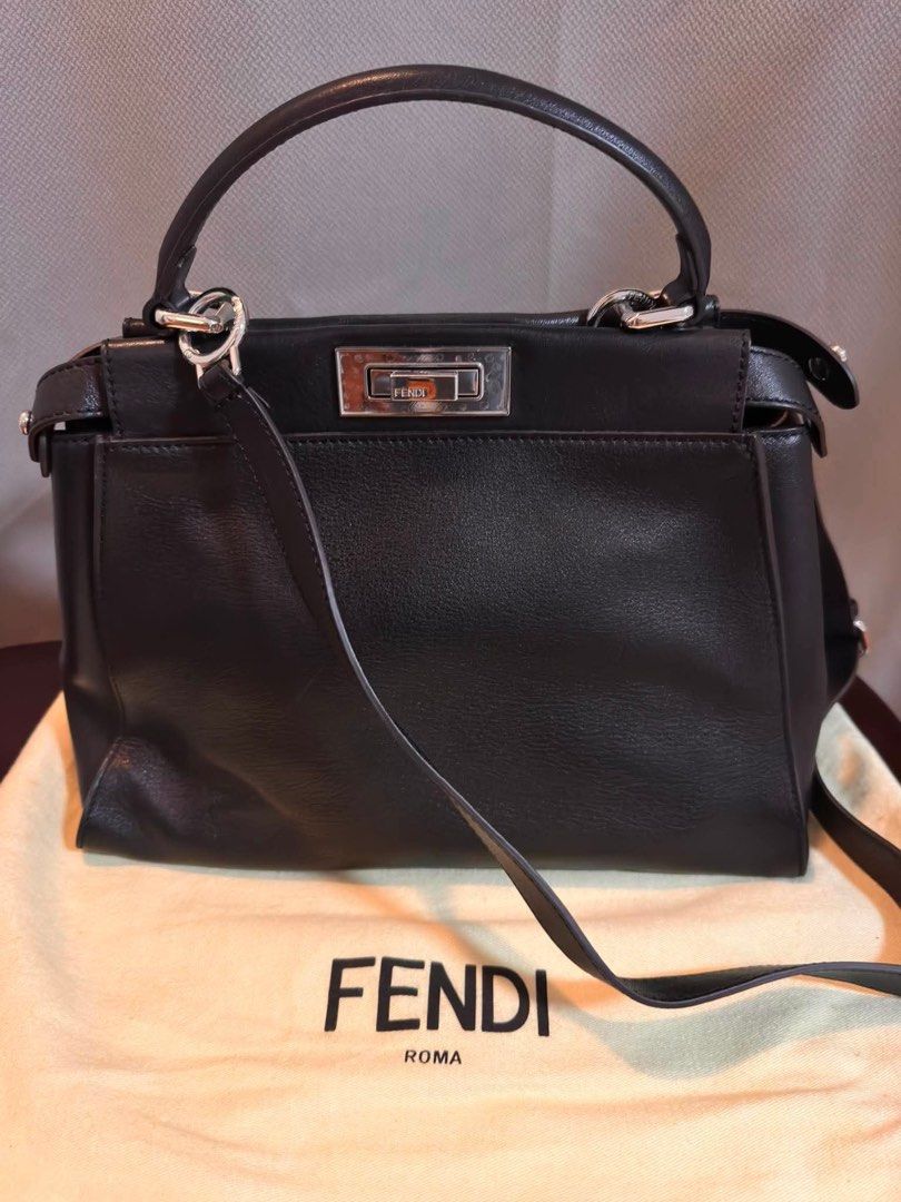 Fendi Peekaboo Medium (Category: Luxury Bags & Wallets) located in Quezon City. Submitted by retroboominwantsummoh (Listing ID 1436807436, Image 1). Description: - Authentic Fendi Peekaboo handbag - Features a top handle and detachable shoulder strap - Silver-tone clasp closure and hardware - Includes dust bag - Made in Italy - Interior with Fendi label and serial number.