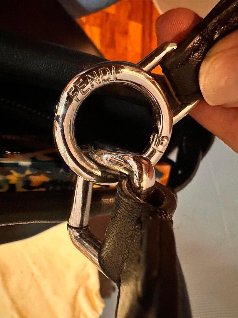 Fendi Peekaboo Medium (Category: Luxury Bags & Wallets) located in Quezon City. Submitted by retroboominwantsummoh (Listing ID 1436807436, Image 3). Description: - Authentic Fendi Peekaboo handbag - Features a top handle and detachable shoulder strap - Silver-tone clasp closure and hardware - Includes dust bag - Made in Italy - Interior with Fendi label and serial number.