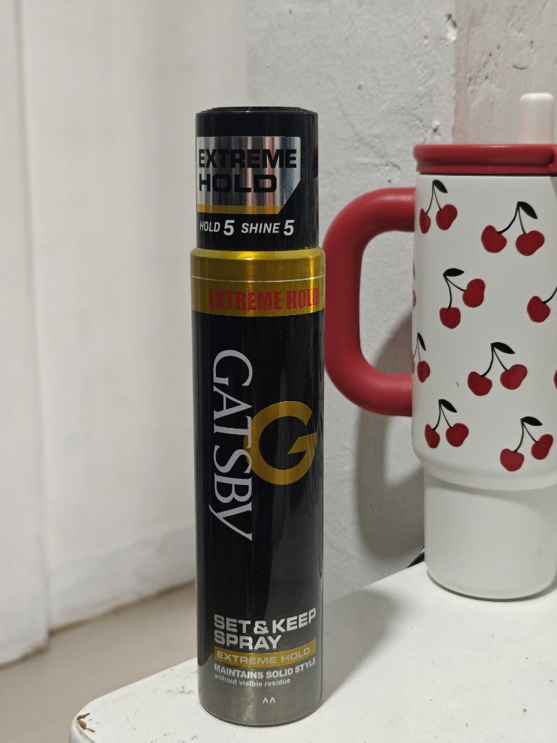 Gatsby Set & Keep Spray Extreme Hold Hair Spray (Category: Hair) located in Balanga. Submitted by einein (Listing ID 1436737982, Image 1). Description: - Gatsby Set & Keep Spray Extreme Hold used 3x - Extreme hold and shine - Size: 250ml / 170g - Expiration Date: January 2029 - Color: Black and Gold.