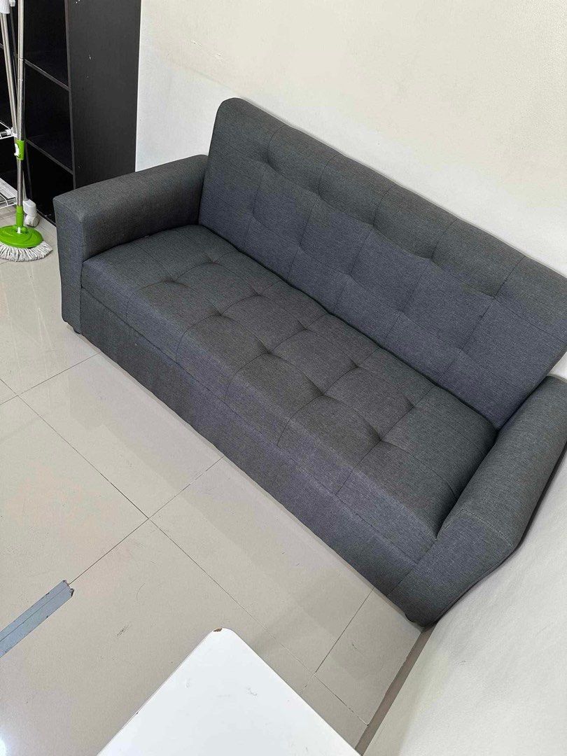 Gray Fabric Sofa (Category: Sofas) located in Manila. Submitted by lykcacamacho (Listing ID 1436774385, Image 2). Description: - Stylish gray fabric sofa - Two-seater size - Protected with plastic wrapping - Perfect for apartments and small spaces - Comfortable seating - Neutral color for easy matching CASH ON DELIVERY VIA LALAMOVE 09664010899 / 09385133266.