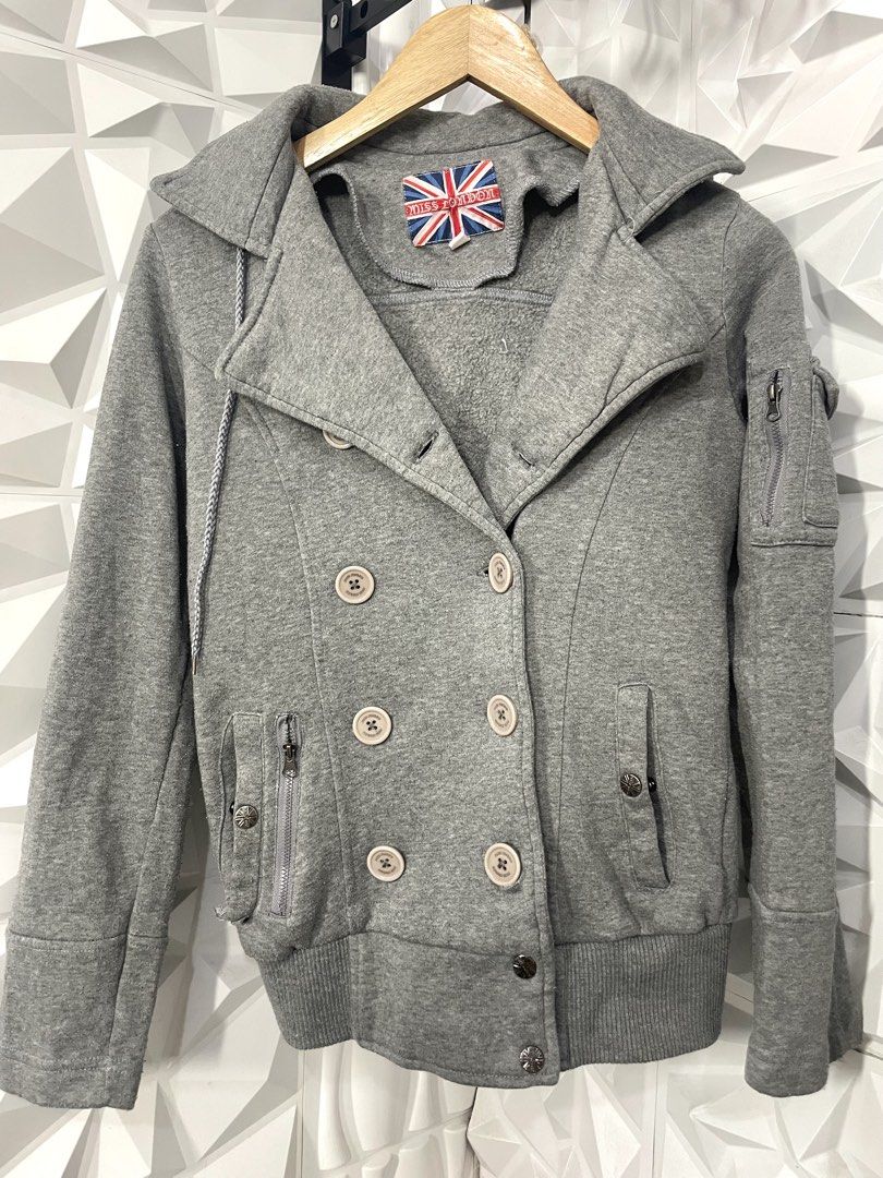 Gray Hooded Jacket for women Med-Large (Category: Coats, Jackets and Outerwear) located in Manila. Submitted by portiahermes (Listing ID 1436743758, Image 3). Description: 📍Great condition apart from one missing snap at the base Gray hooded jacket from Miss London. Features a double-breasted design with multiple buttons and pockets. Includes a hood with a drawstring. The jacket has a ribbed hem and cuffs. The brand label is visible inside the co