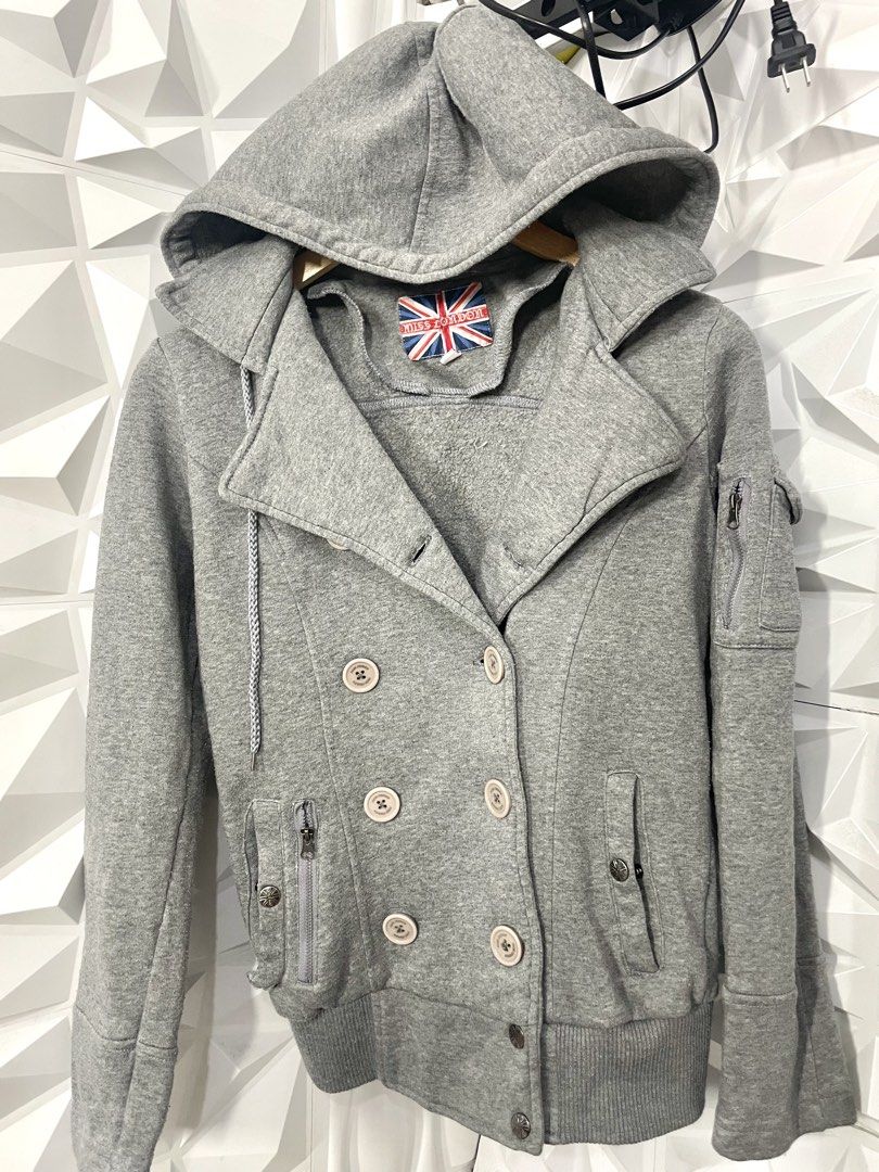 Gray Hooded Jacket for women Med-Large (Category: Coats, Jackets and Outerwear) located in Manila. Submitted by portiahermes (Listing ID 1436743758, Image 1). Description: 📍Great condition apart from one missing snap at the base Gray hooded jacket from Miss London. Features a double-breasted design with multiple buttons and pockets. Includes a hood with a drawstring. The jacket has a ribbed hem and cuffs. The brand label is visible inside the co