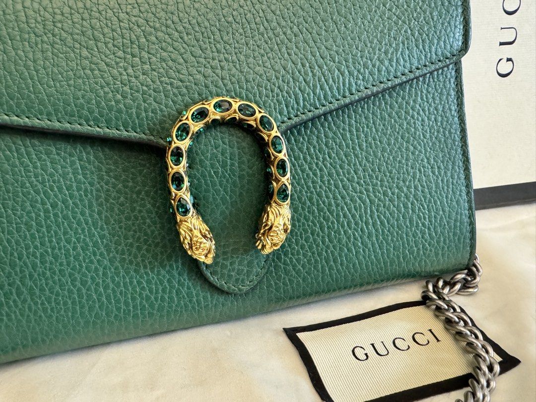 Gucci Dionysus Chain Wallet Green (Category: Luxury Bags & Wallets) located in Manila. Submitted by mayserrano16 (Listing ID 1436664833, Image 3). Description: - Authentic Gucci Dionysus chain wallet - Stunning green color - Signature tiger head closure with green crystals - Includes original box, dust bag, and authenticity card - Silver-toned chain strap - Ideal for everyday use or special events.
