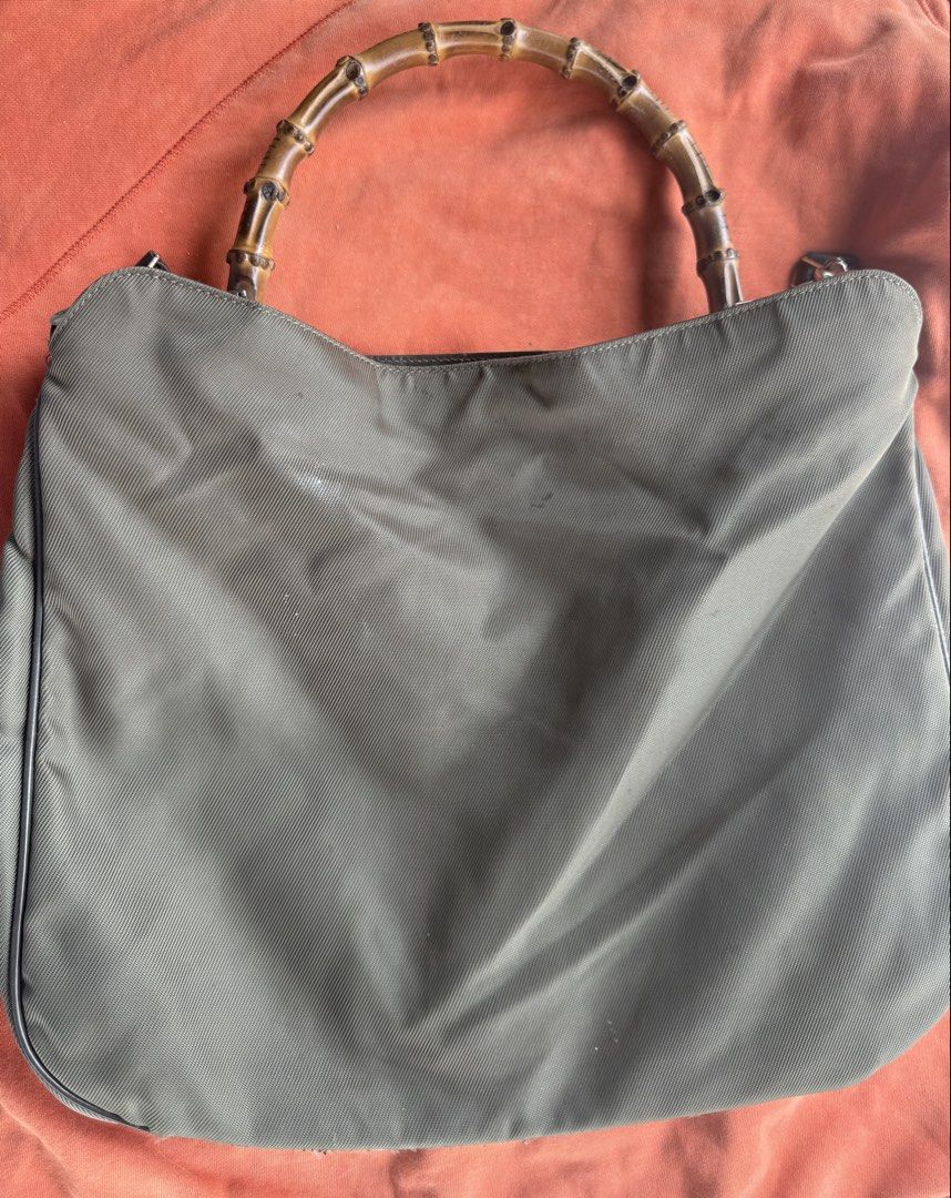 GUCCI vintage bamboo bag (Category: Luxury Bags & Wallets) located in Malabon City. Submitted by everythinggoeson (Listing ID 1436708557, Image 1). Description: nylon bag with bamboo handle & strap with flaw on the side pero pwede patahi authentic & preloved .