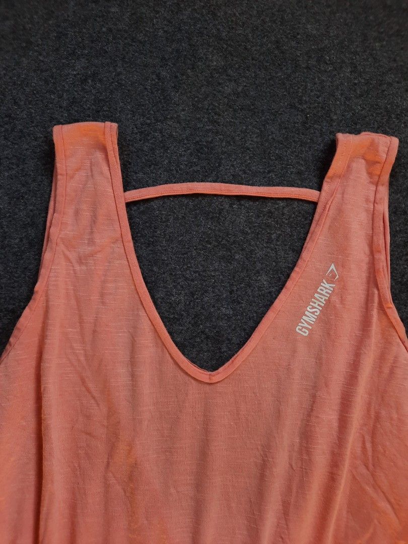 Gymshark Coral Tank Top (Category: Activewear) located in San Jose del Monte. Submitted by leslymhey (Listing ID 1436735638, Image 2). Description: - Gymshark coral tank top - Size: Large-xl - Unique open back design with strap detail - Gymshark logo on front - Made of lightweight, breathable fabric - Ideal for workouts or casual wear.