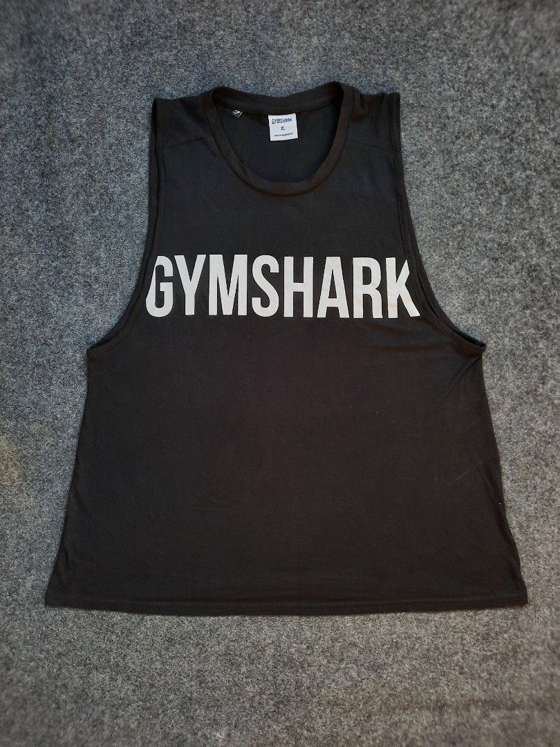 Gymshark Impact Drop Arm Tank slim fit (Category: Activewear) located in San Jose del Monte. Submitted by leslymhey (Listing ID 1436734456, Image 1). Description: - Gymshark tank top - Size: L-XL - Color: Black - Design: Round neck, sleeveless - Material: Soft and comfortable - Suitable for: Workouts and casual wear - Features: Gymshark logo visible.
