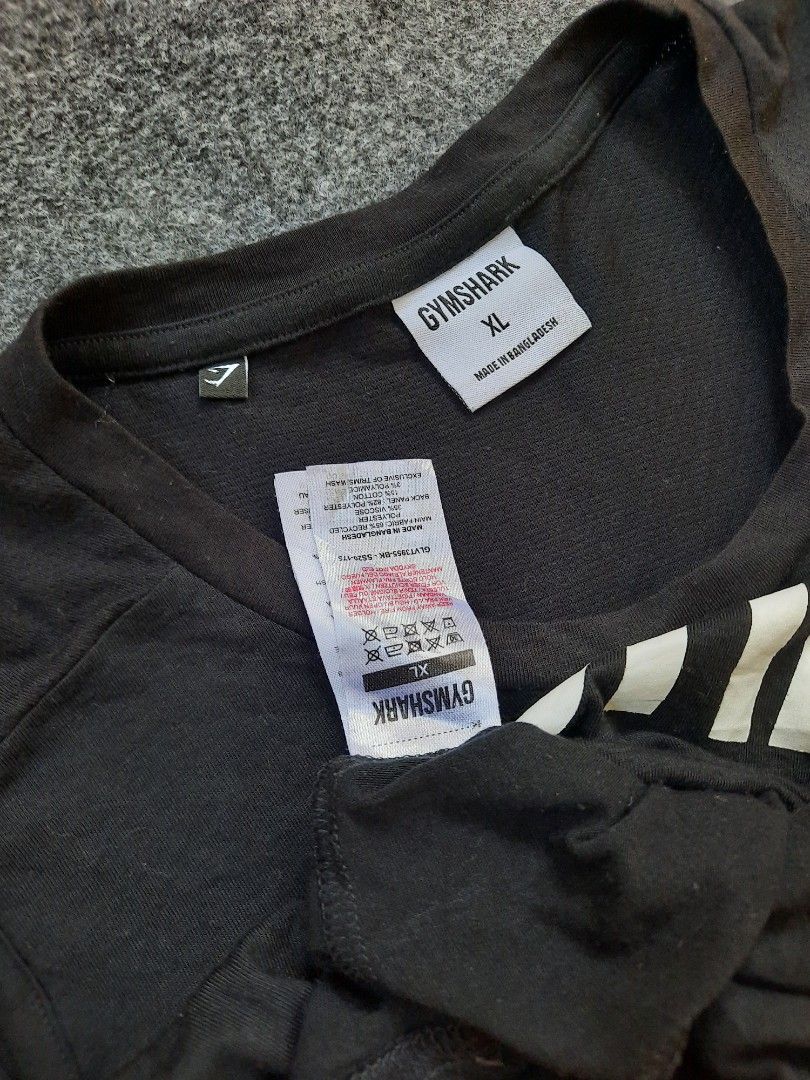 Gymshark Impact Drop Arm Tank slim fit (Category: Activewear) located in San Jose del Monte. Submitted by leslymhey (Listing ID 1436734456, Image 3). Description: - Gymshark tank top - Size: L-XL - Color: Black - Design: Round neck, sleeveless - Material: Soft and comfortable - Suitable for: Workouts and casual wear - Features: Gymshark logo visible.