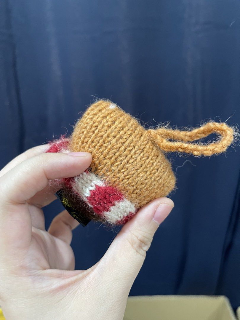 Handmade Knitted Fox Ornament (Category: Handmade Craft) located in Taguig. Submitted by supplementary (Listing ID 1436682924, Image 2). Description: - Handmade knitted fox ornament - Features a brown body and white face - Includes a red and white striped scarf - Has black eyes - Comes with a small loop for hanging - Perfect for home decor or as a unique gift.