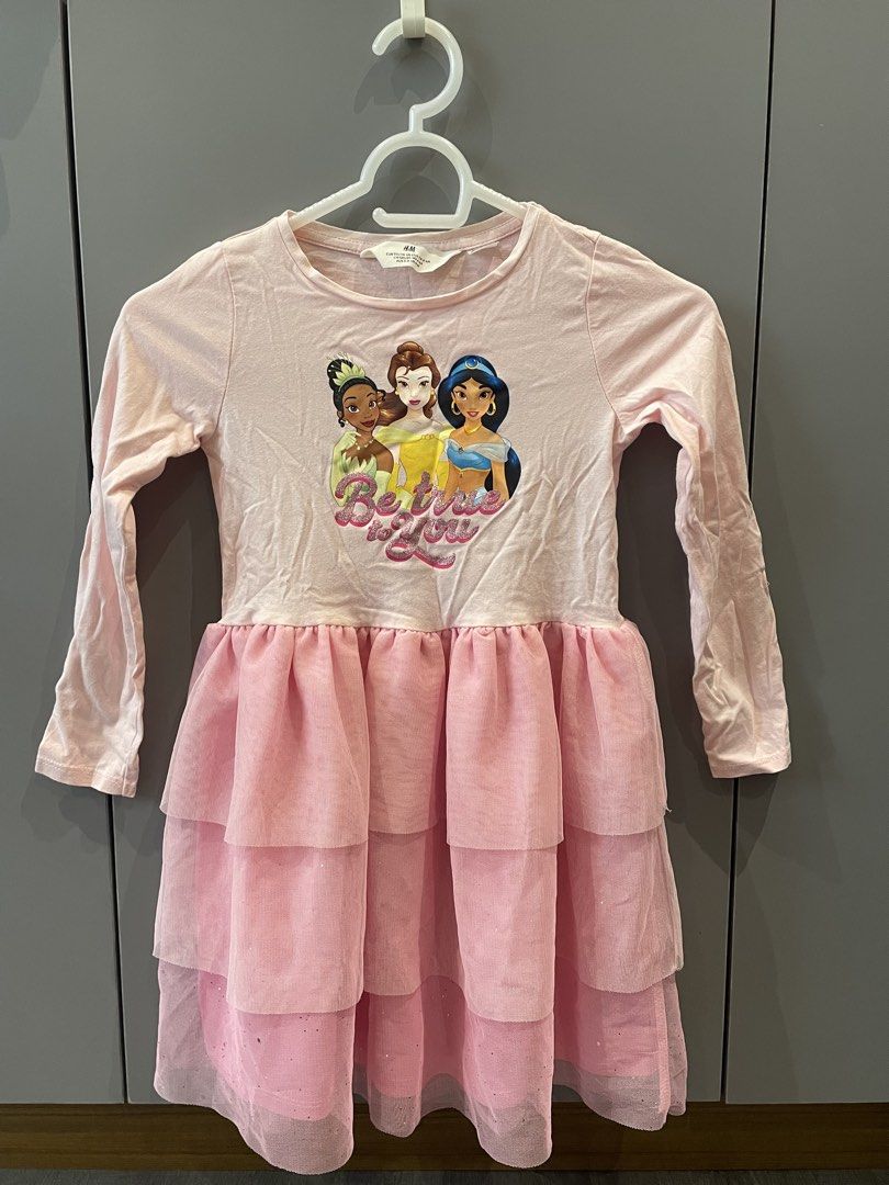 H&M Disney Princess Dress (Category: Babies & Kids Fashion) located in Taguig. Submitted by vivi_028 (Listing ID 1436723388, Image 1). Description: - H&M Disney Princess Dress - Pink color - Features a princess graphic - Long sleeves - Tiered, layered skirt - Size: EUR 110/116, US 5T/6, CA 4-6A, AUS 5-6, UK 5-6A - Ideal for little princesses!.
