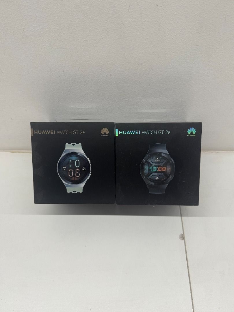 Huawei Watch GT 2e and GT 2 (Category: Wearables & Smart Watches) located in Manila. Submitted by cbla06 (Listing ID 1436748966, Image 1). Description: Two Huawei smartwatches are available. One is the GT 2e, and the other is the GT 2. Both watches are in their original boxes. The GT 2e has a light-colored strap, while the GT 2 has a black strap. Both are brand new and sealed..