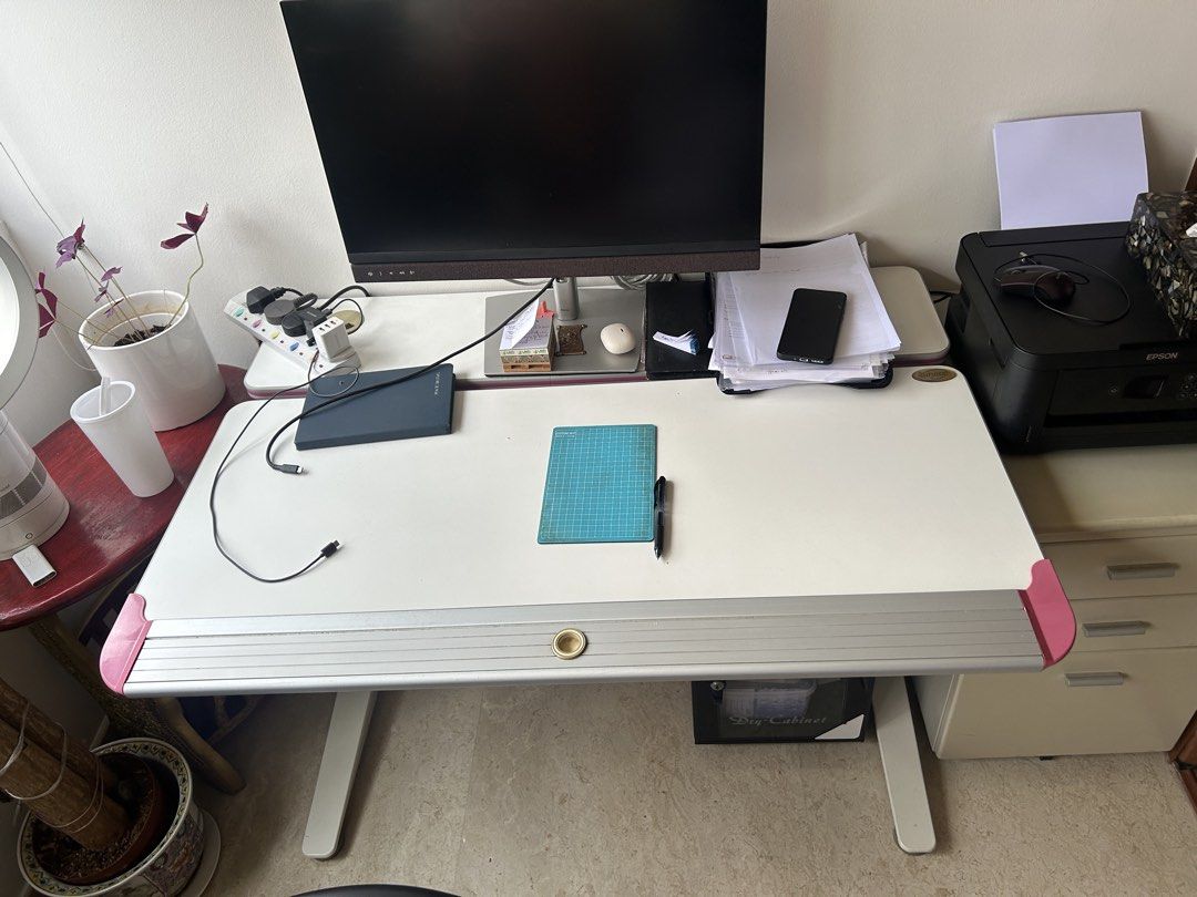 Impact study table (Category: Tables & Sets) located in Singapore. Submitted by PRiya (Listing ID 1436748182, Image 3). Description: - Adjustable drafting table - Tiltable surface - Built-in storage drawer - Clean white surface with pink accents - Sturdy base - Perfect for artists and designers.