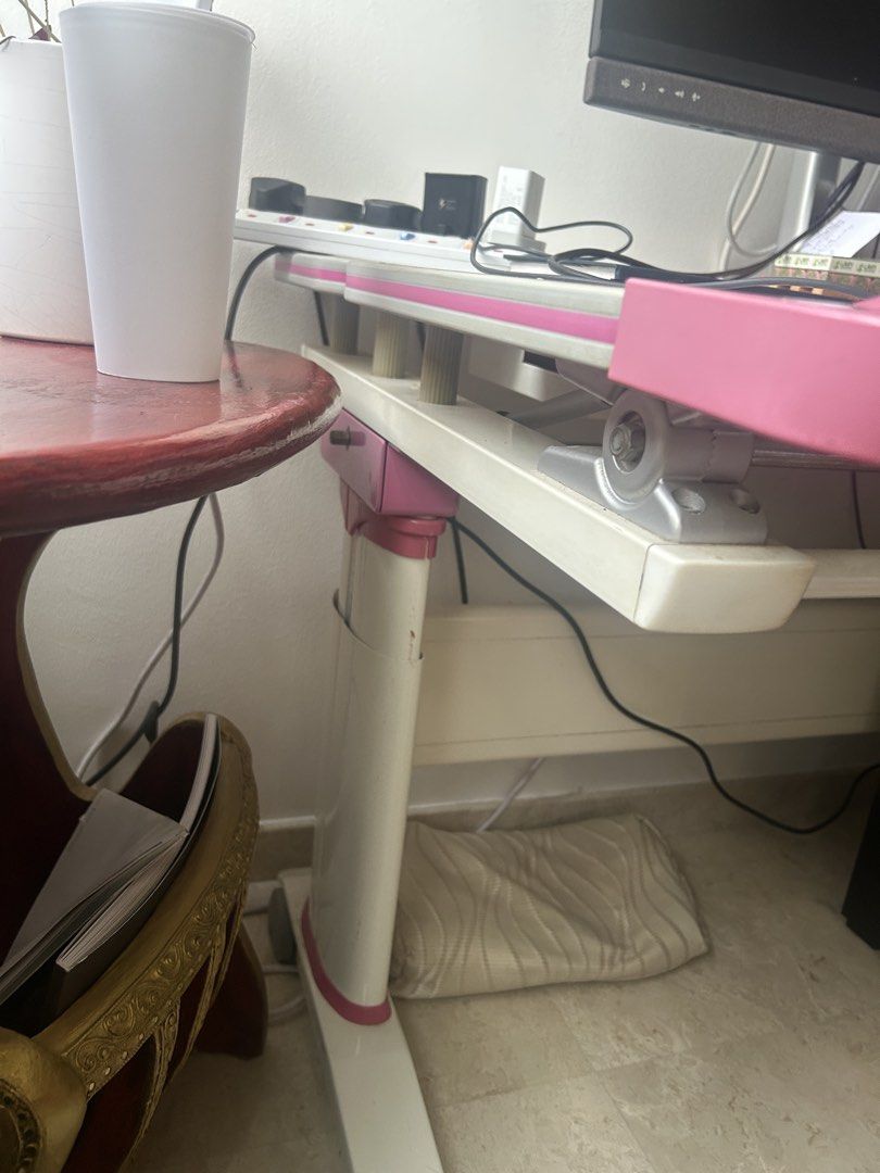 Impact study table (Category: Tables & Sets) located in Singapore. Submitted by PRiya (Listing ID 1436748182, Image 2). Description: - Adjustable drafting table - Tiltable surface - Built-in storage drawer - Clean white surface with pink accents - Sturdy base - Perfect for artists and designers.