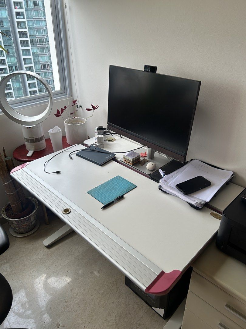 Impact study table (Category: Tables & Sets) located in Singapore. Submitted by PRiya (Listing ID 1436748182, Image 1). Description: - Adjustable drafting table - Tiltable surface - Built-in storage drawer - Clean white surface with pink accents - Sturdy base - Perfect for artists and designers.
