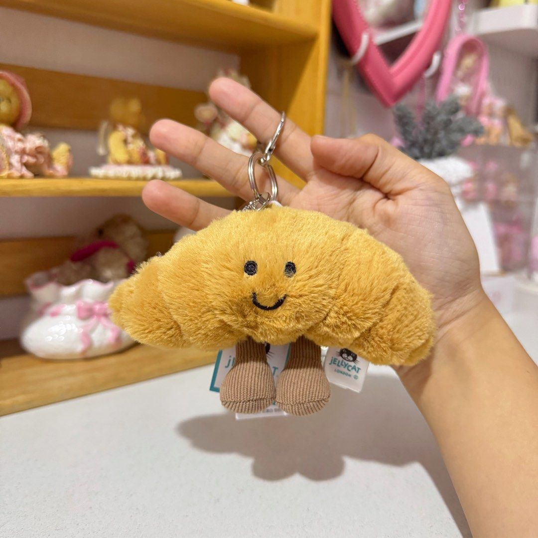 Jellycat Croissant Keychain Plush (Category: Plushies & Soft Toys) located in Manila. Submitted by ashyyel_ (Listing ID 1436769958, Image 1). Description: no bag authenticity not guaranteed .
