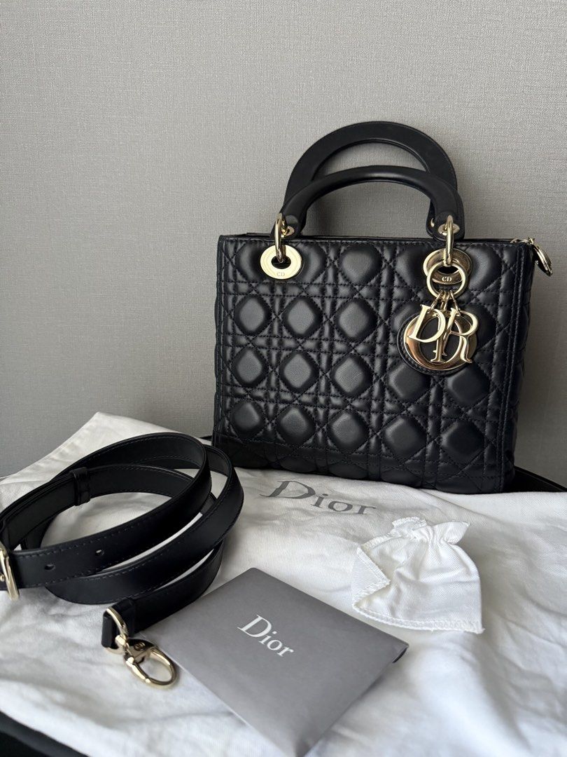 Lady Dior Medium (Category: Luxury Bags & Wallets) located in Quezon City. Submitted by revive.co (Listing ID 1436810531, Image 1). Description: Lady Dior Medium GHW Navy Blue good condition. with signs of usage. zippered version (2019) free bag liner 100% authentic.