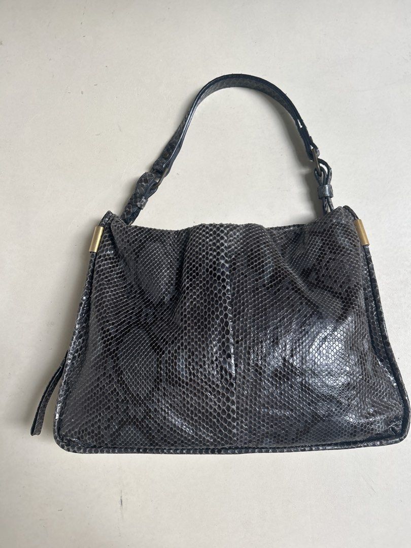 Lanvin Python Leather Handbag (Category: Bags & Wallets) located in Singapore. Submitted by supersizedlife (Listing ID 1436653458, Image 1). Description: - Authentic Lanvin handbag - Genuine python leather - Top handle and detachable chain strap - Made in Italy - Minimal wear, clean interior - Stylish and unique.