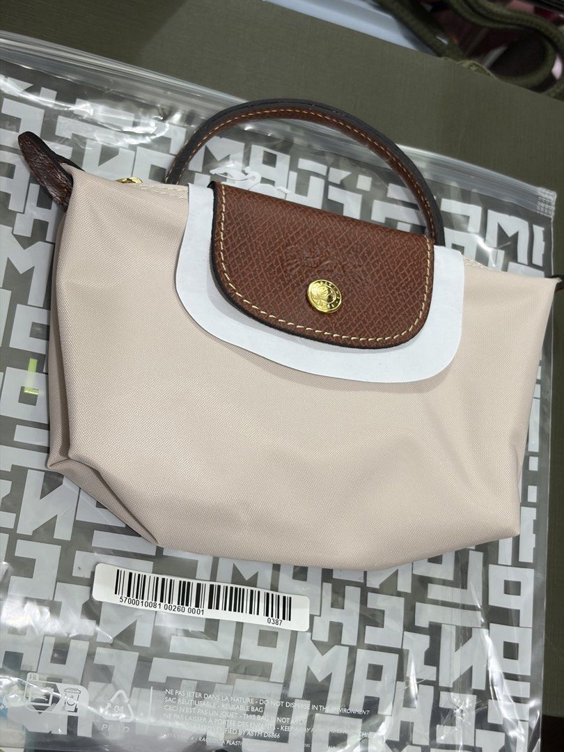 Longchamp Mini Pouch in Papier (Category: Luxury Bags & Wallets) located in Pasay City. Submitted by theluxefinds.phonhand (Listing ID 1436667615, Image 1). Description: Original Longchamp pouch can attached sling for crossbody Pouch only 6999 With sling generic only 7290 With ziplock and paperbag Surebuyer only Original 💯.