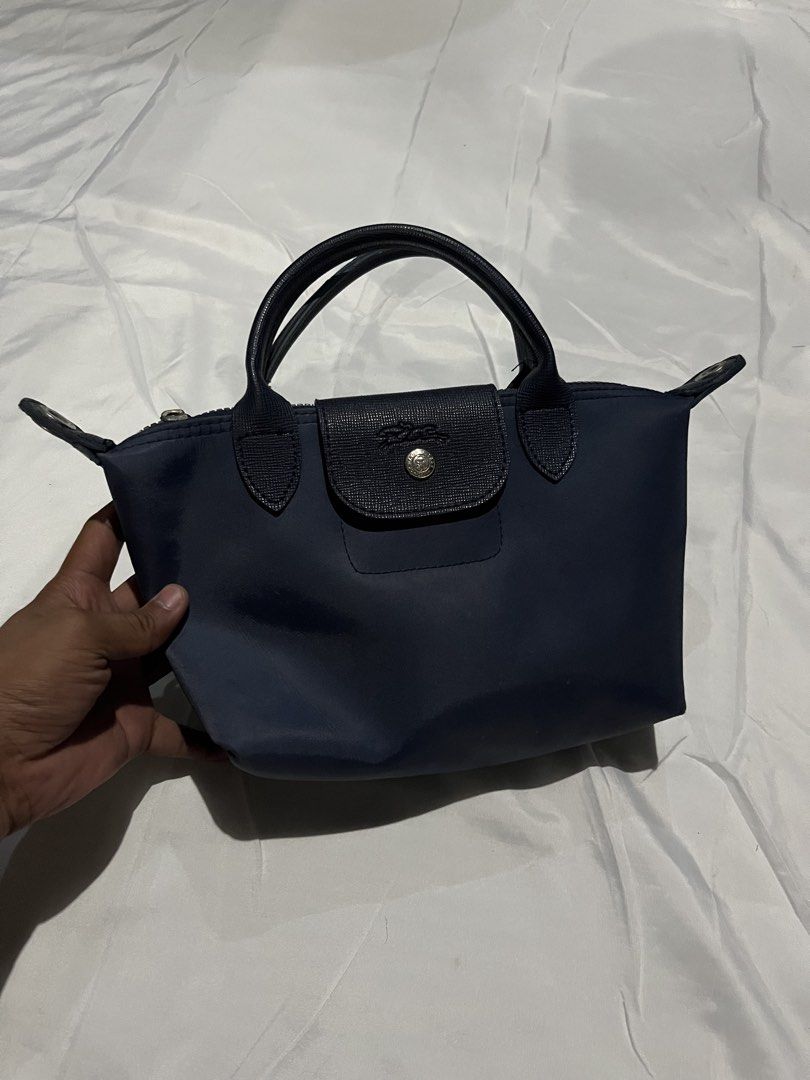 Longchamp Modele Depose Mini (Category: Luxury Bags & Wallets) located in Adams. Submitted by princess.maggie (Listing ID 1436769010, Image 1). Description: - lightly used - missing sling - sign of usage only.