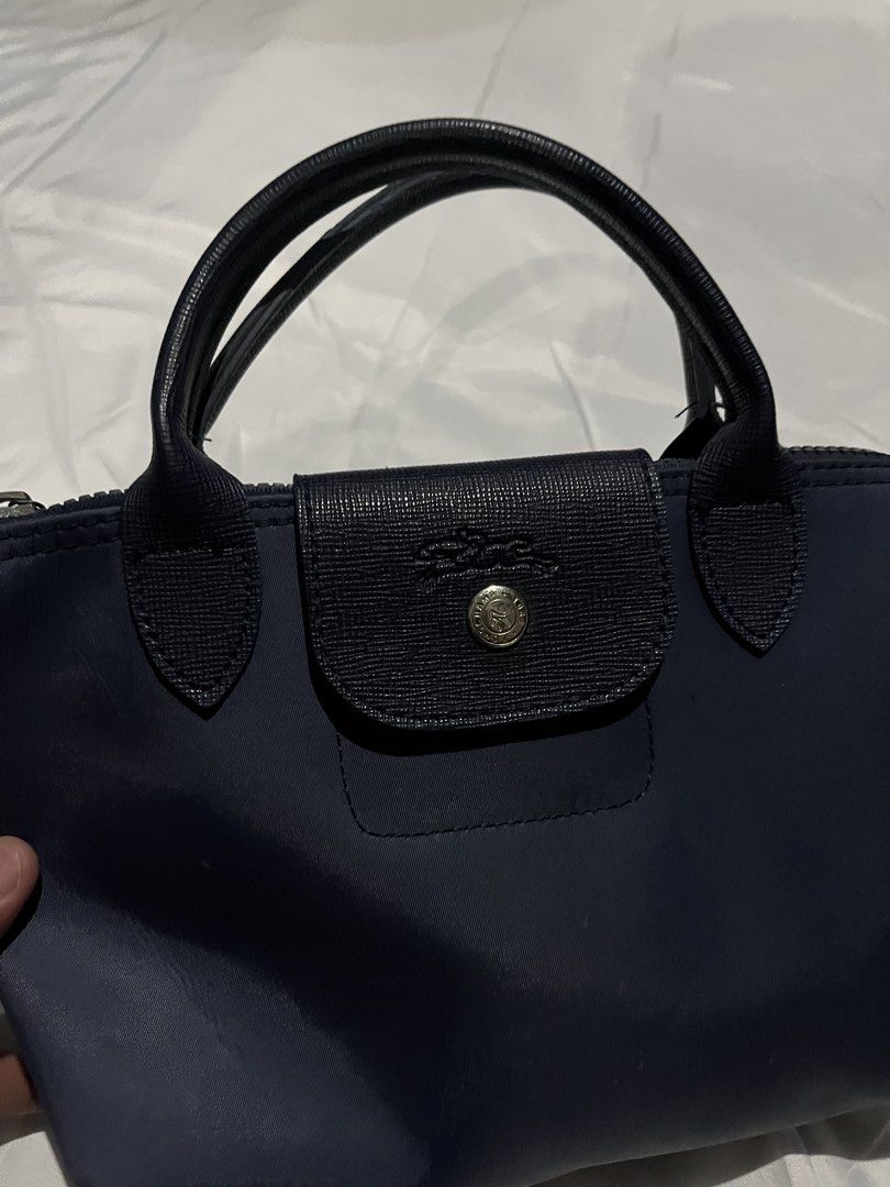 Longchamp Modele Depose Mini (Category: Luxury Bags & Wallets) located in Adams. Submitted by princess.maggie (Listing ID 1436769010, Image 2). Description: - lightly used - missing sling - sign of usage only.