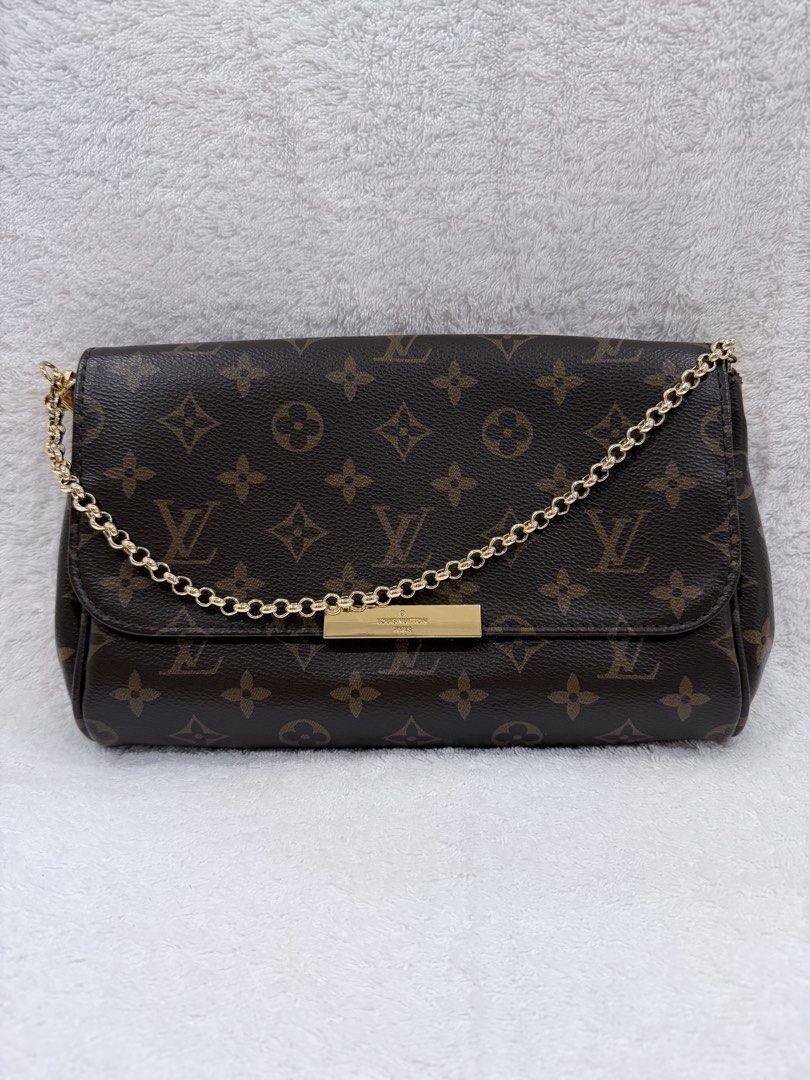Louis Vuitton Felicie Pochette Monogram (Category: Luxury Bags & Wallets) located in Makati City. Submitted by neejga (Listing ID 1436675842, Image 1). Description: - Louis Vuitton Felicie Pochette - Monogram canvas - Gold-tone chain strap - Detachable leather strap - Flap closure with gold-tone metal plate - Includes - Burgundy interior - Classic LV monogram pattern -Japan bought ANG.