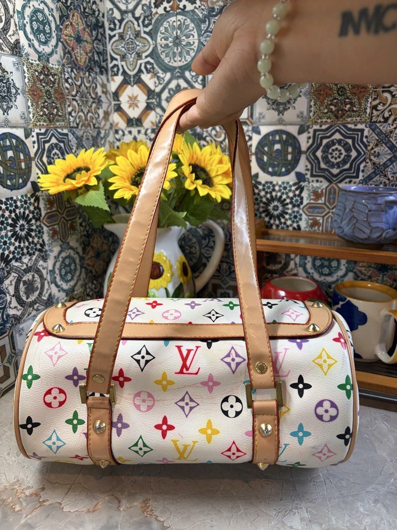 Louis Vuitton Multicolor Cylinder Bag (Category: Luxury Bags & Wallets) located in Pasig City. Submitted by bettinab27 (Listing ID 1436708710, Image 3). Description: - NGA Louis Vuitton Cylinder Bag - Multicolor design - Top handle and bow detail - Secure lock closure - Iconic LV monogram pattern - Light tan interior - Gold-tone hardware - Studded accents - Zipper closure.
