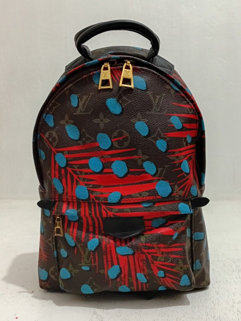 LV Palm Springs Canvas Leather Small Backpack (Category: Luxury Bags & Wallets) located in Navotas City. Submitted by riyuwi (Listing ID 1436748118, Image 1). Description: PreOwned Lightly Used LV Monogram Palm Springs Canvas leather backpack. Small-Medium - Eye-catching pattern with red and blue accents. - Classic brown background. - Comfortable top handle and adjustable shoulder straps. - Interior with black lining and a pocket. - Stylish gold-