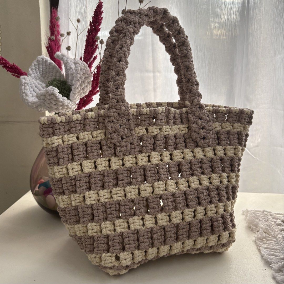 Macrame Handbag (Category: Shoulder Bags) located in Pasig City. Submitted by sinta_studio (Listing ID 1436664338, Image 1). Description: - Handmade macrame handbag - Features a woven design - Equipped with sturdy handles - Perfect for everyday use - Adds a touch of bohemian style.