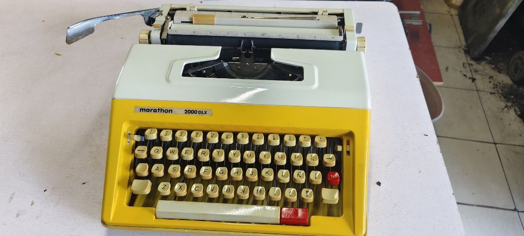 Marathon 2000dlx Typewriter manual (Category: Office & Business Technology) located in Manila. Submitted by tagaberick37031 (Listing ID 1436766834, Image 1). Description: Vintage Marathon 3000 SLX typewriter in a retro yellow and white design. Features a full keyboard, carriage return lever, and paper guide. Keys appear intact..