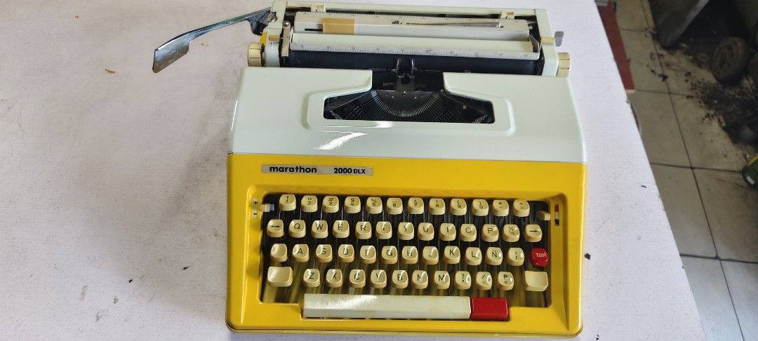 Marathon 2000dlx Typewriter manual (Category: Office & Business Technology) located in Manila. Submitted by tagaberick37031 (Listing ID 1436766834, Image 2). Description: Vintage Marathon 3000 SLX typewriter in a retro yellow and white design. Features a full keyboard, carriage return lever, and paper guide. Keys appear intact..