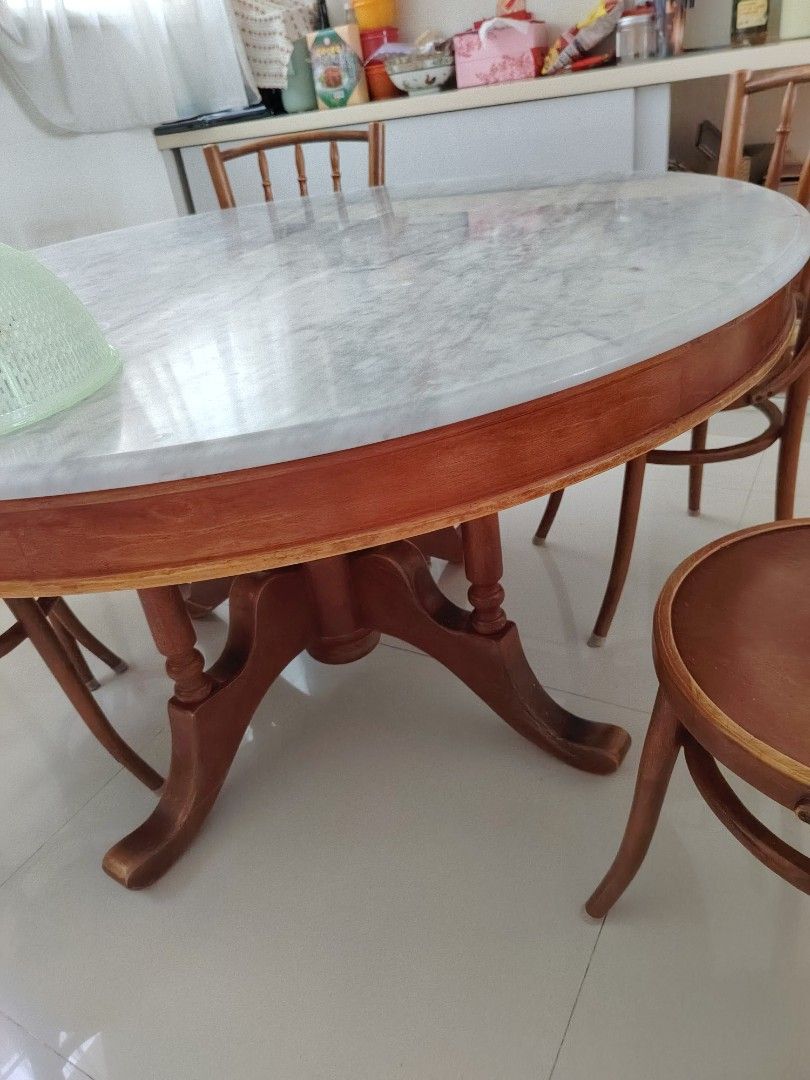 Marble dining table (Category: Tables & Sets) located in Singapore. Submitted by rizuki9283 (Listing ID 1436705686, Image 1). Description: Height 30cm Diameter 55cm approximately Chairs 15 each 6 chairs altogether.