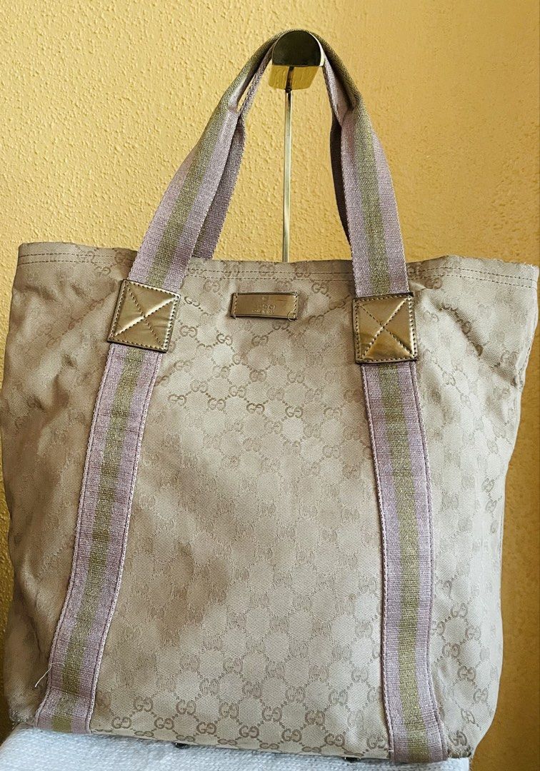 MILESTONE SALE: Medium Brown shoulder/hand bag (Category: Shoulder Bags) located in Dasmarinas. Submitted by hwcatbp (Listing ID 1436662207, Image 2). Description: MILESTONE SALE FROM 4999 to 3999 ℹ️ Medium Brown shoulder/hand bag ℹ️ Condition: Good Used condition (Rank 7/10). Picture taken on natural light. ℹ️ Details: 17x6x15 inches. Soft canvas monogram bag with pink and soft sparkles on handles. North -South bag. ℹ️ Inclusions: Generic dust b