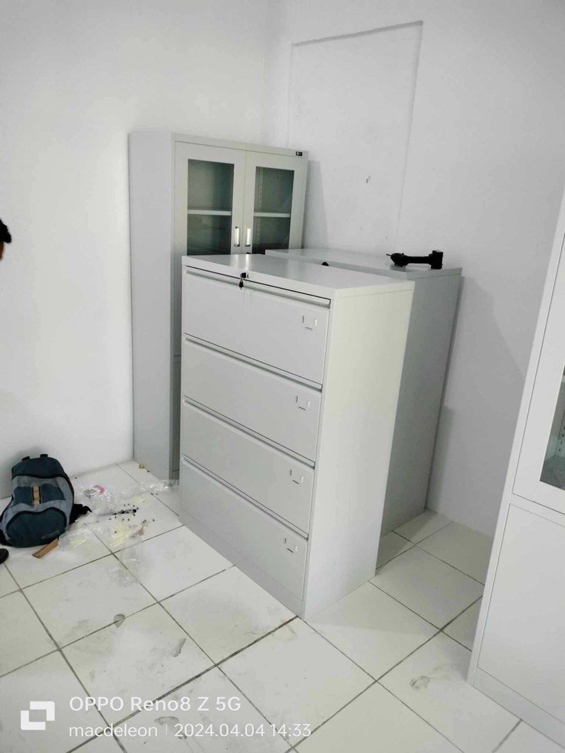 Metal Filing Cabinet with 4 Drawers (Category: Office Furniture & Fixtures) located in Manila. Submitted by lykcacamacho (Listing ID 1436767865, Image 2). Description: - Four-drawer metal filing cabinet - Features a secure lock - Elegant light gray finish - Ideal for office or home use.