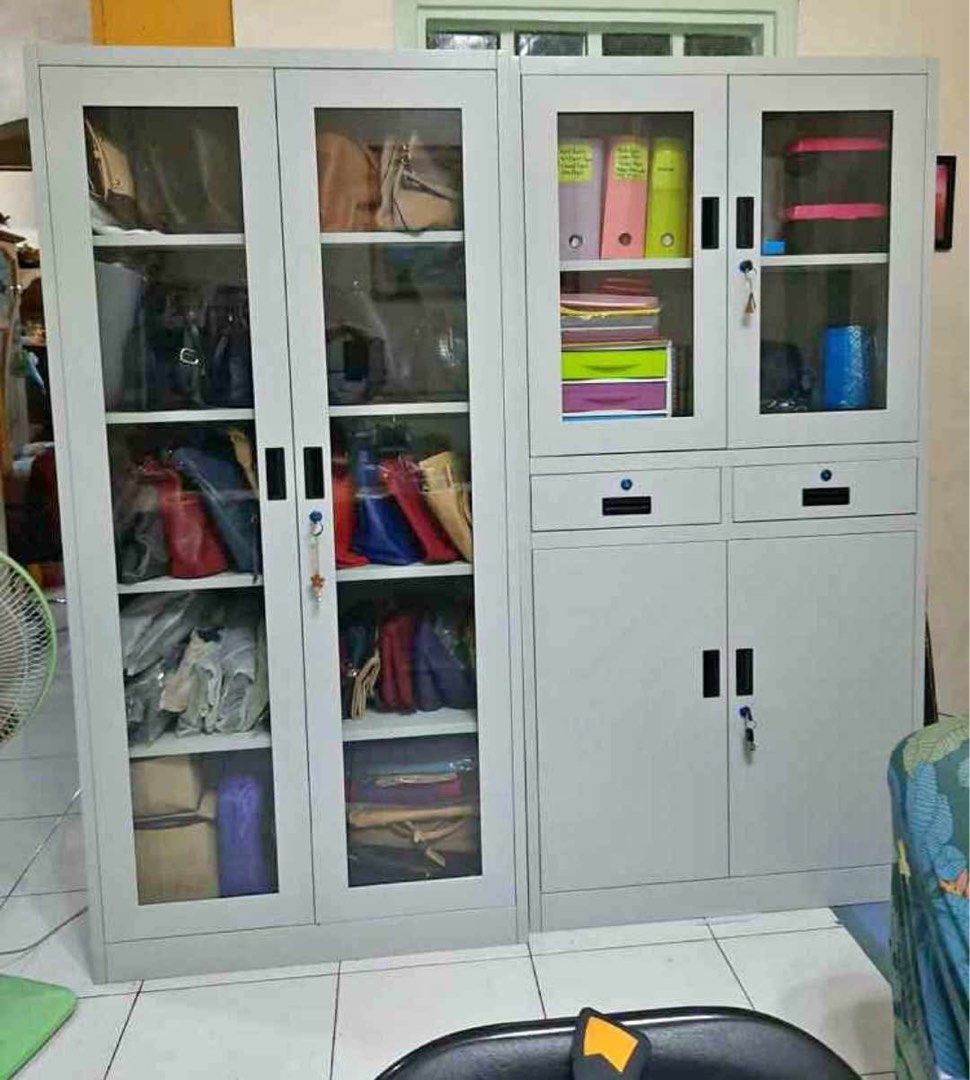 Metal Storage Cabinet with Glass Doors (Category: Shelves, Cabinets & Racks) located in Manila. Submitted by lykcacamacho (Listing ID 1436704664, Image 3). Description: - Durable metal storage cabinet - Glass doors - Multiple shelves for organized storage - Available in various sizes and configurations - Options include sliding doors and drawers - Ideal for pantry items, pet supplies, or general storage - Some units with locking mechanisms - Suit