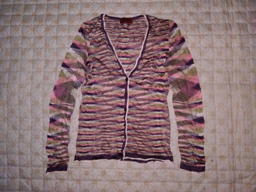 Missoni Striped Knit Cardigan (Category: Coats, Jackets and Outerwear) located in Zamboanga. Submitted by nurbya898048 (Listing ID 1436822450, Image 1). Description: - Authentic Missoni cardigan - Size: 38/medium - Features a vibrant striped pattern (pink, purple, green) - Made in Italy - Design: V-neckline, button closure - Fabric: Knit material - Condition excellent - Color rate 9.8/10 - Presentable, no flaws - See all photos for details 750+sh