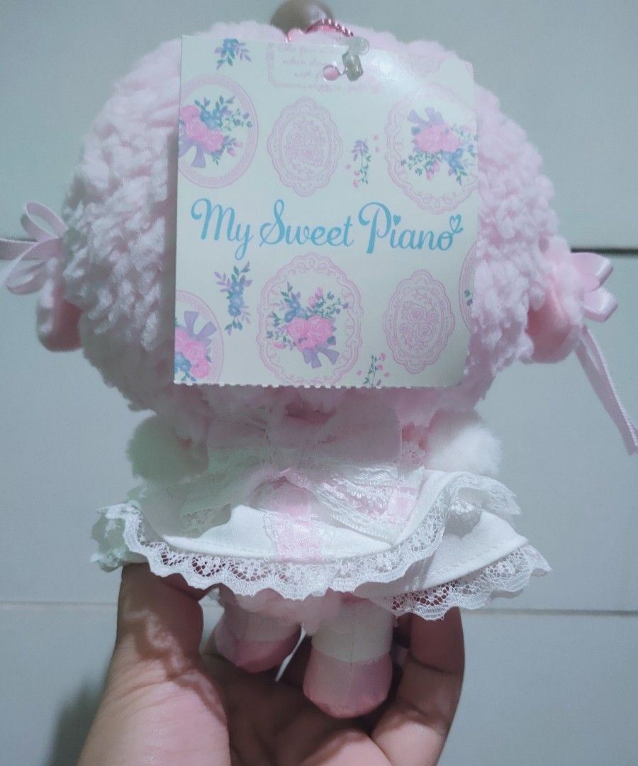 My Sweet Piano Plush Toy (Category: Plushies & Soft Toys) located in San Juan City. Submitted by raremountain_5de9b2 (Listing ID 1436769685, Image 2). Description: - Adorable My Sweet Piano plush toy - Features a charming pink and white color scheme - Comes with a cute frilly dress and headpiece - Includes the original tag - Perfect for collectors or as a gift - Soft and cuddly design.
