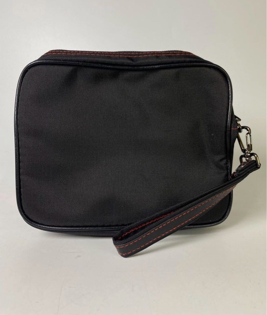 Nikon Camera Bag with Wrist Strap (Category: Camera Bags & Carriers) located in Bacoor. Submitted by banananana12 (Listing ID 1436707989, Image 3). Description: Nikon Mutipurpose Bag With multiple pockets With hand strap 8 x 6 inches - Stylish red stitching - Convenient wrist strap - Main compartment with zipper closure - Secure front flap with snap closures - Internal zippered pocket - Additional pocket under the flap - Features the iconic Nikon