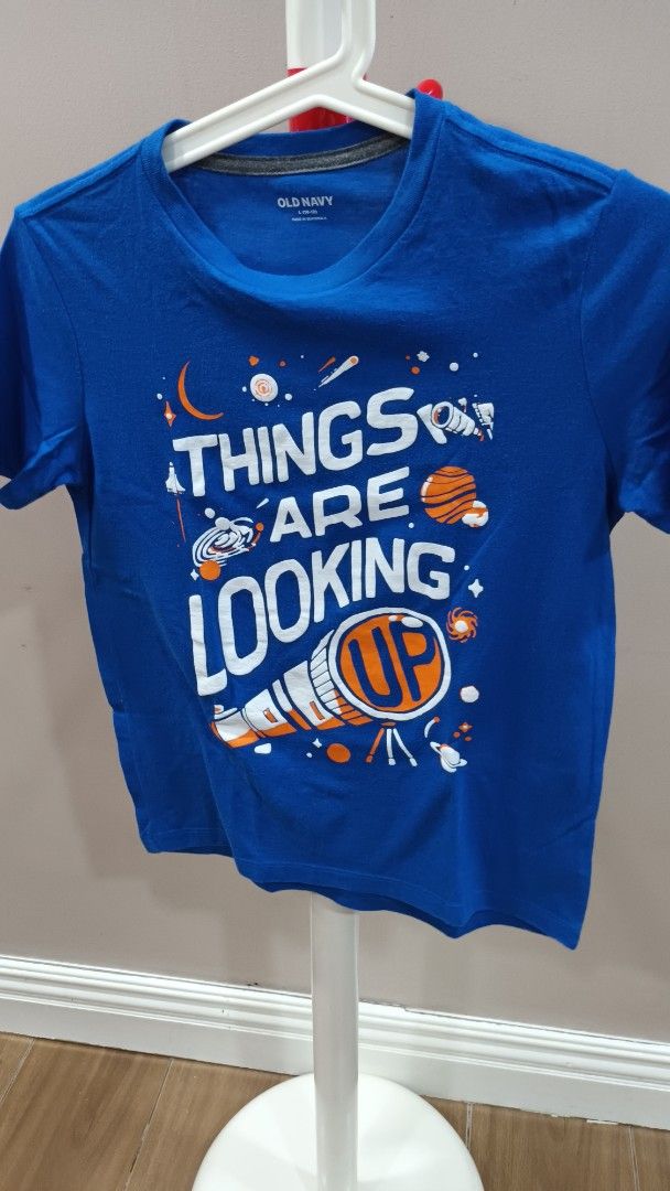 Old Navy Blue Graphic T-shirt (Category: Babies & Kids Fashion) located in Quezon City. Submitted by ddgapstore (Listing ID 1436714856, Image 1). Description: - Old Navy T-shirt - Blue color - Size: L (10-12) - Crew neck, short sleeves.
